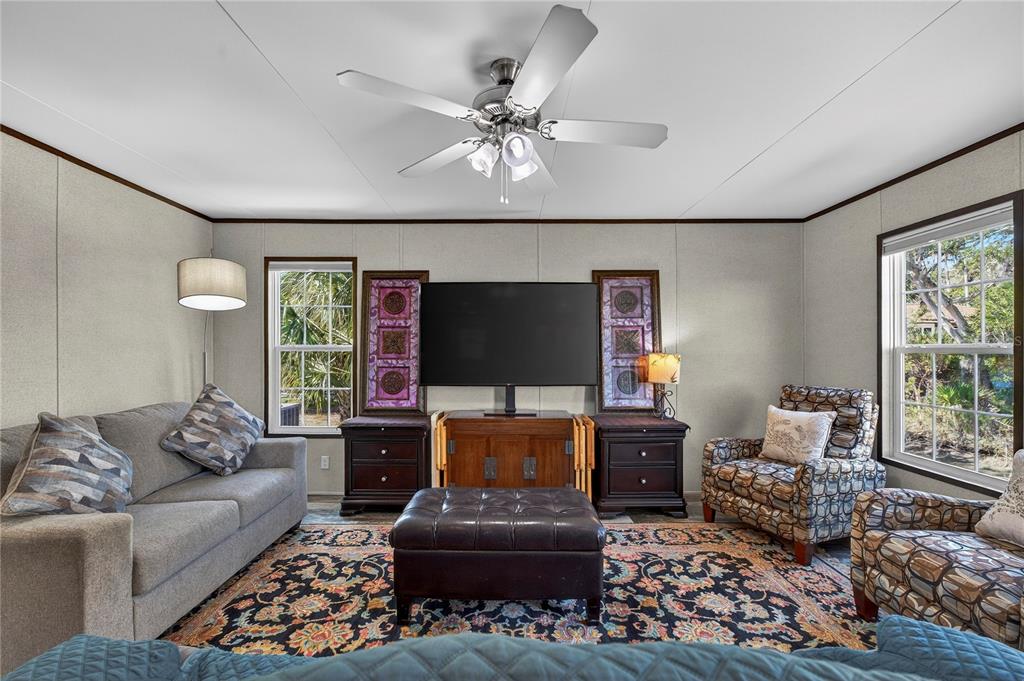 185 Coleman Street Edgewater, FL 32141 - Photo 8 of 47 a living room with furniture and a flat screen tv
