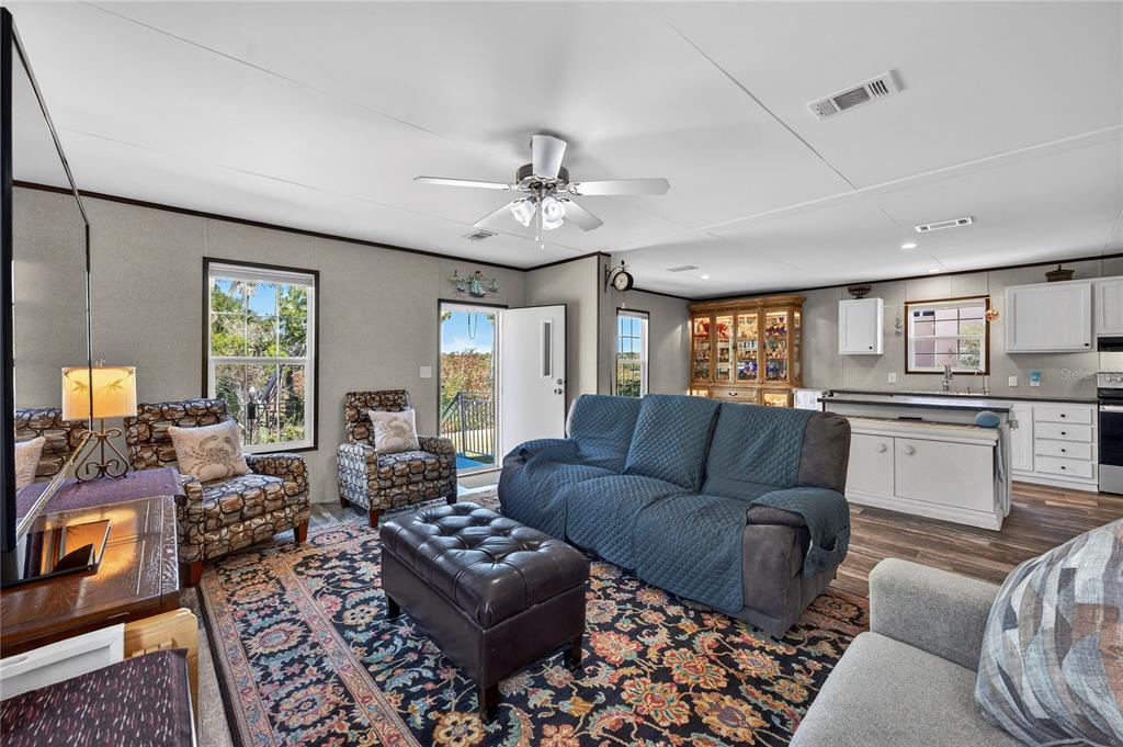 185 Coleman Street Edgewater, FL 32141 - Photo 9 of 47 a living room with furniture and a large window