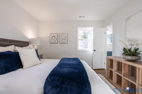 a bedroom with bed and a window