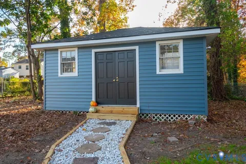 front view of a house with a yard