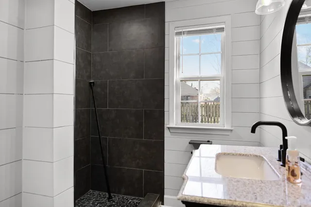 a bathroom with a bathtub and window