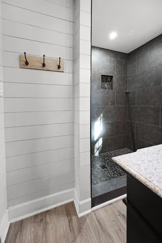 a bathroom with a shower and a sink