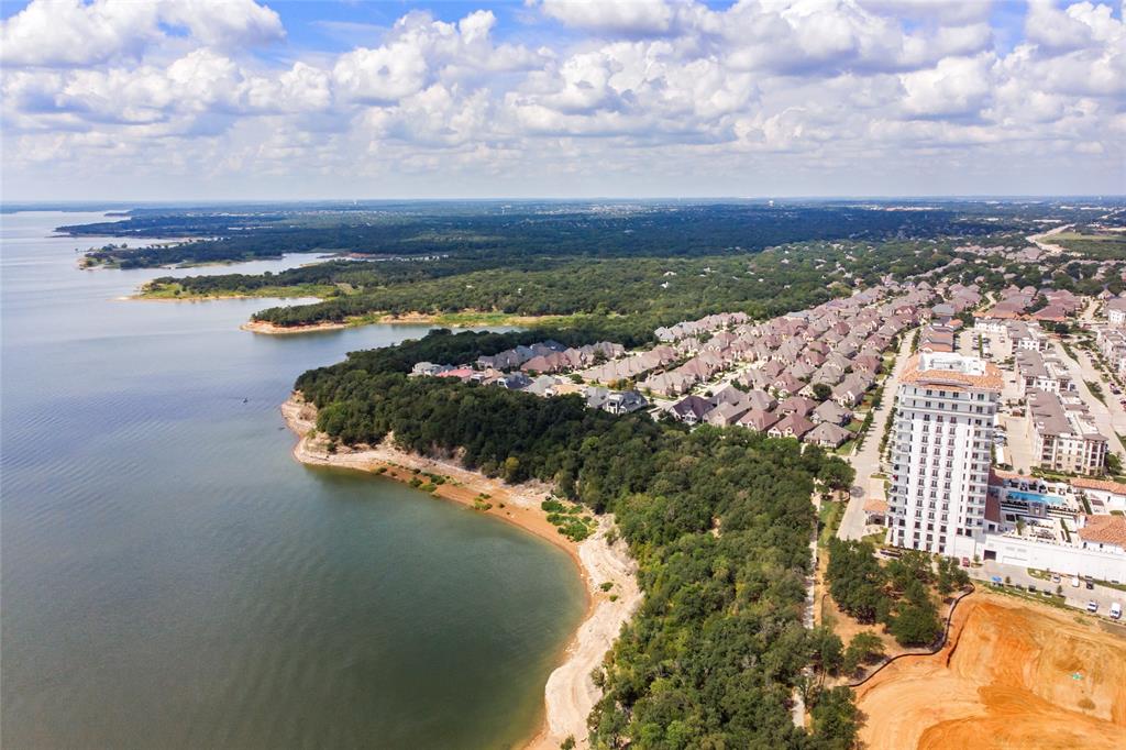 516 Sandy Lane Flower Mound, TX 75022 - Photo 37 of 38 Expansive lake frontage with a wooded shoreline, featuring a residential community with numerous properties