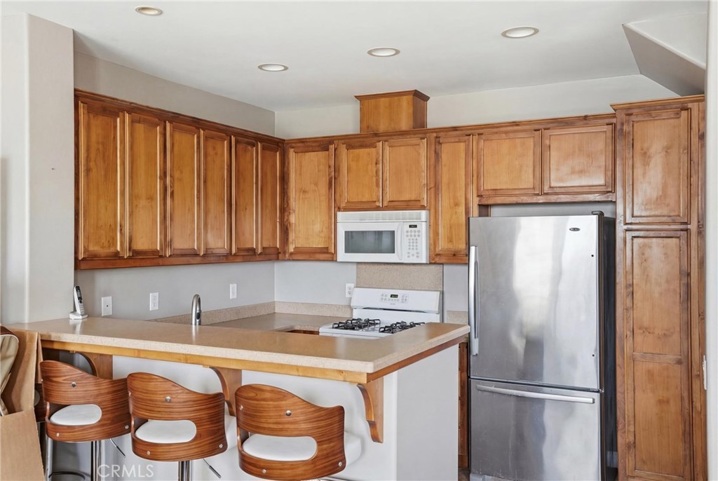131 Watering Place Templeton, CA 93465 - Photo 11 of 27 a kitchen with granite countertop stainless steel appliances a refrigerator and a sink