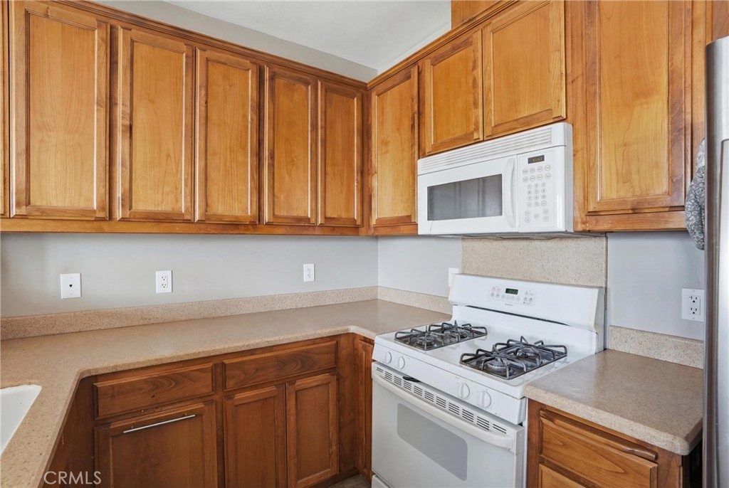 131 Watering Place Templeton, CA 93465 - Photo 13 of 27 a kitchen with granite countertop cabinets stainless steel appliances a sink and wooden floor