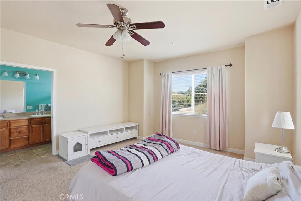 131 Watering Place Templeton, CA 93465 - Photo 16 of 27 a bedroom with a large bed and a window