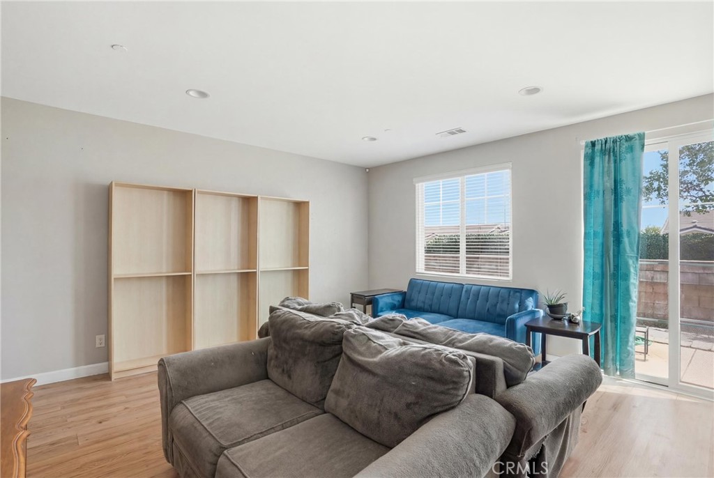 131 Watering Place Templeton, CA 93465 - Photo 8 of 27 a living room with furniture window and a wooden floor