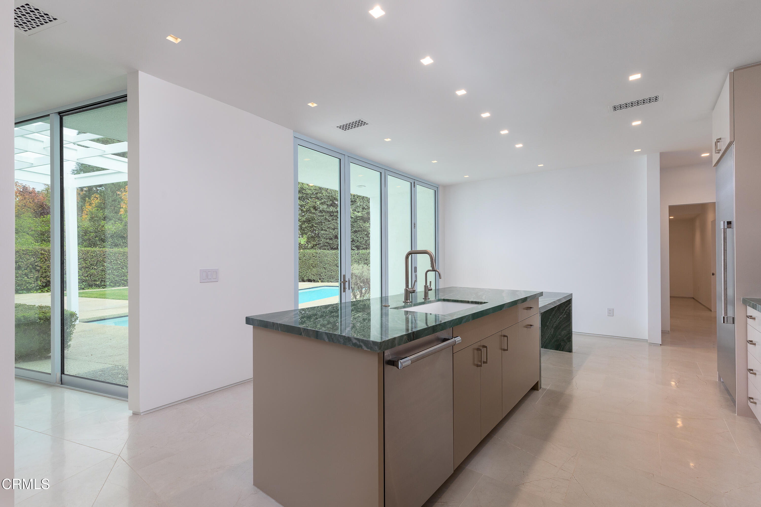 800 Canon Drive Pasadena, CA 91106 - Photo 16 of 49 a kitchen with stainless steel appliances granite countertop a sink and a large window