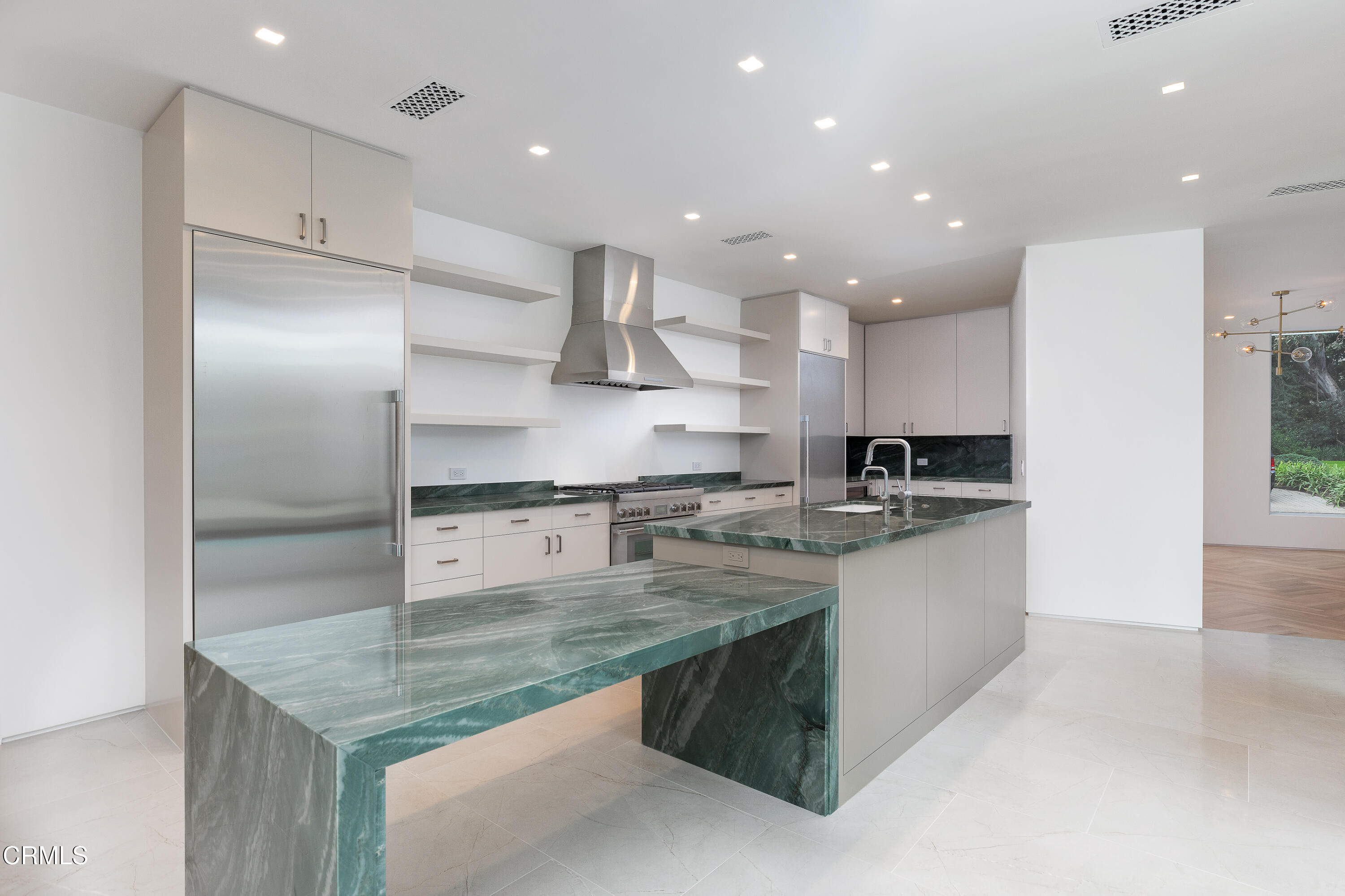 800 Canon Drive Pasadena, CA 91106 - Photo 20 of 49 a kitchen with stainless steel appliances granite countertop a sink stove and refrigerator