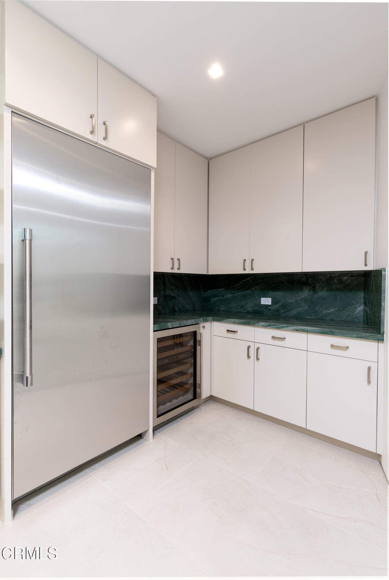 800 Canon Drive Pasadena, CA 91106 - Photo 22 of 49 a kitchen with granite countertop white cabinets and white appliances