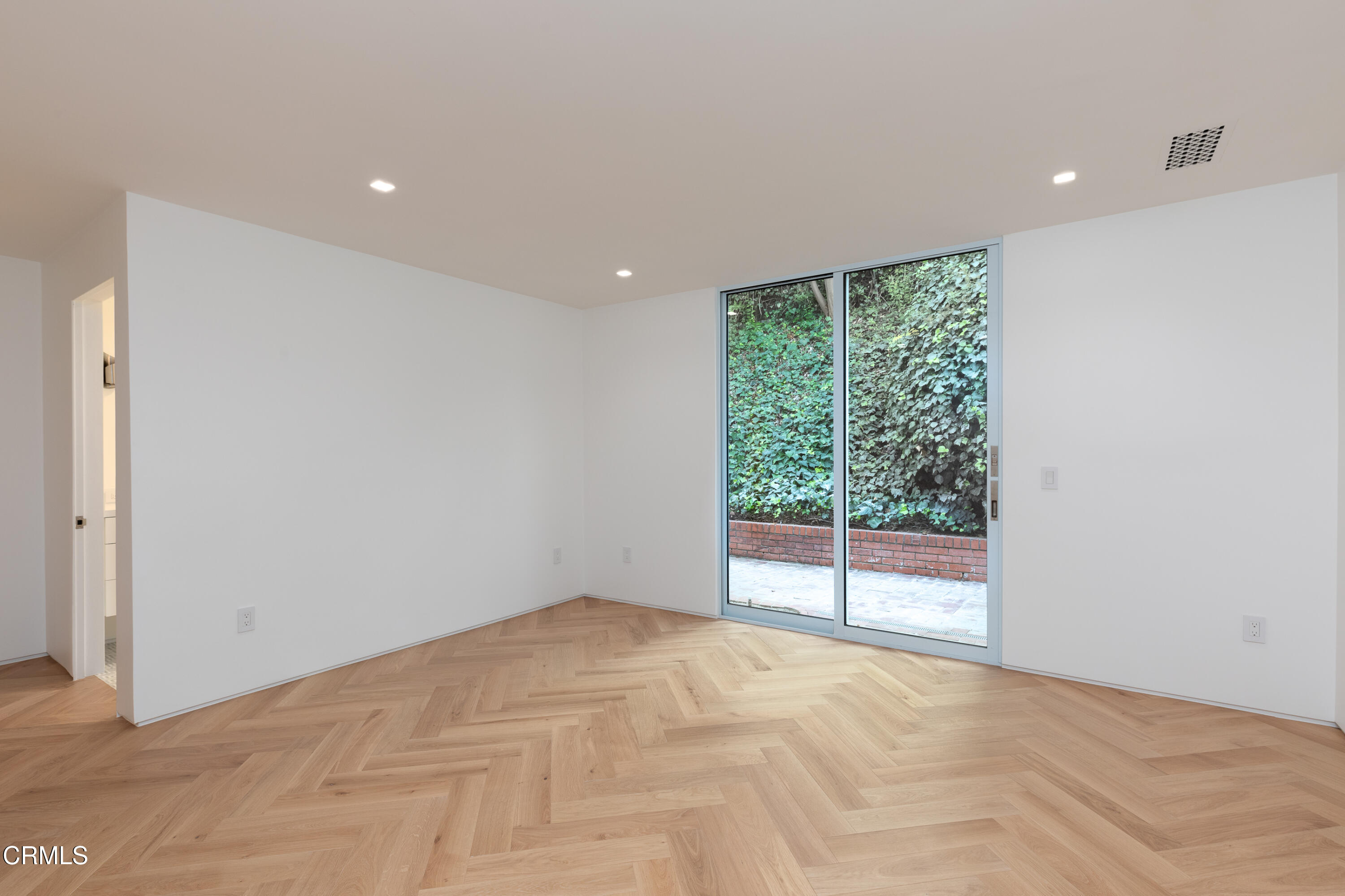 800 Canon Drive Pasadena, CA 91106 - Photo 36 of 49 a view of an empty room with wooden floor and windows