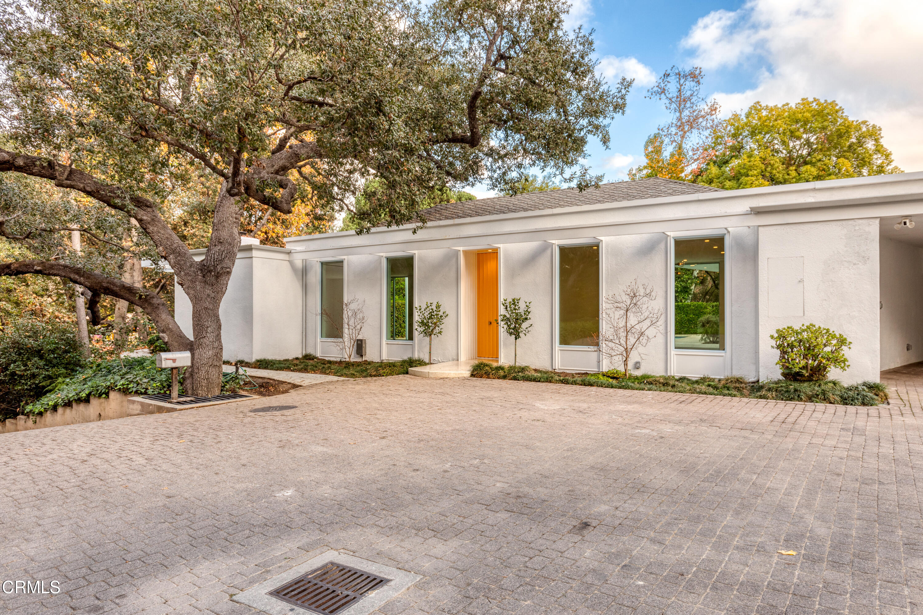 800 Canon Drive Pasadena, CA 91106 - Photo 4 of 49 front view of a house with a floor to ceiling windows and a basket ball poll
