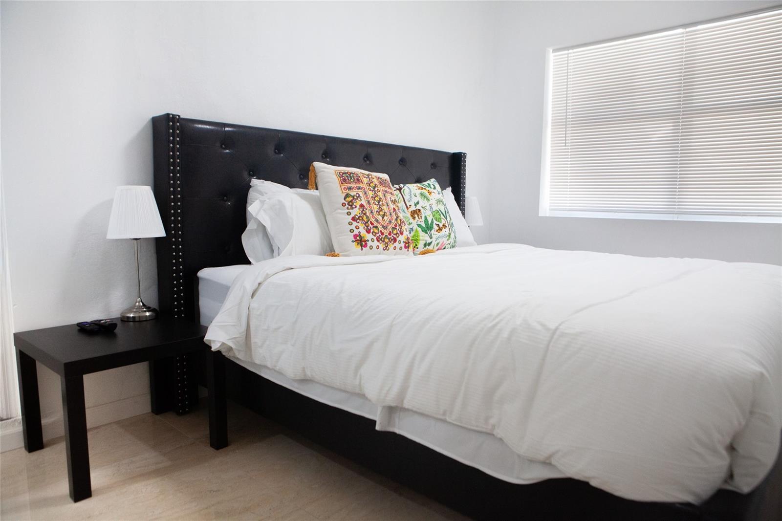 1821 Harding Street, Unit 12 Hollywood, FL 33020 - Photo 11 of 14 a bedroom with a bed and a window
