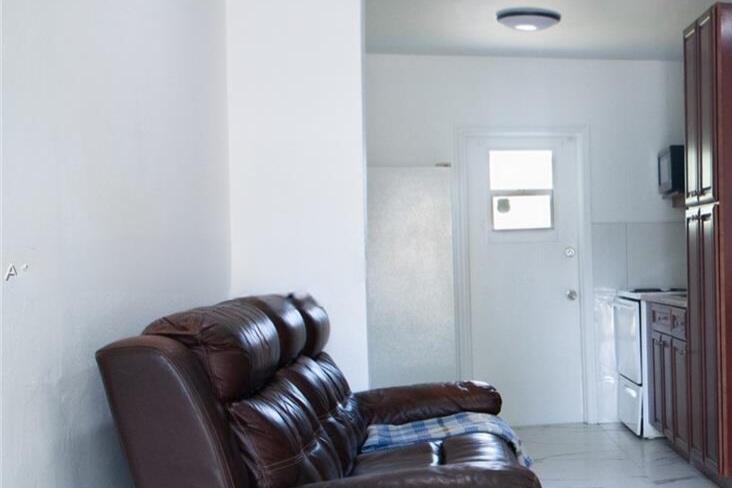 1821 Harding Street, Unit 12 Hollywood, FL 33020 - Photo 6 of 14 a room with furniture and a couch