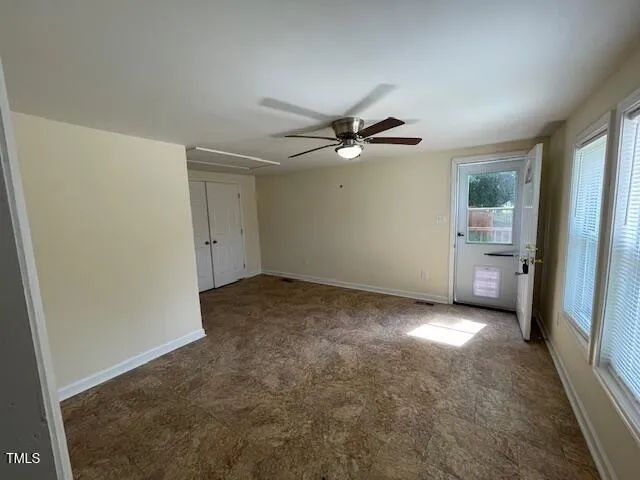 an empty room with a bathroom