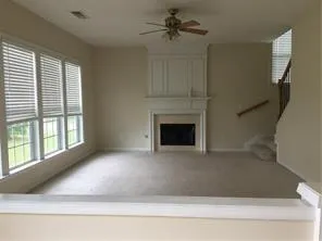 a view of empty room with fireplace