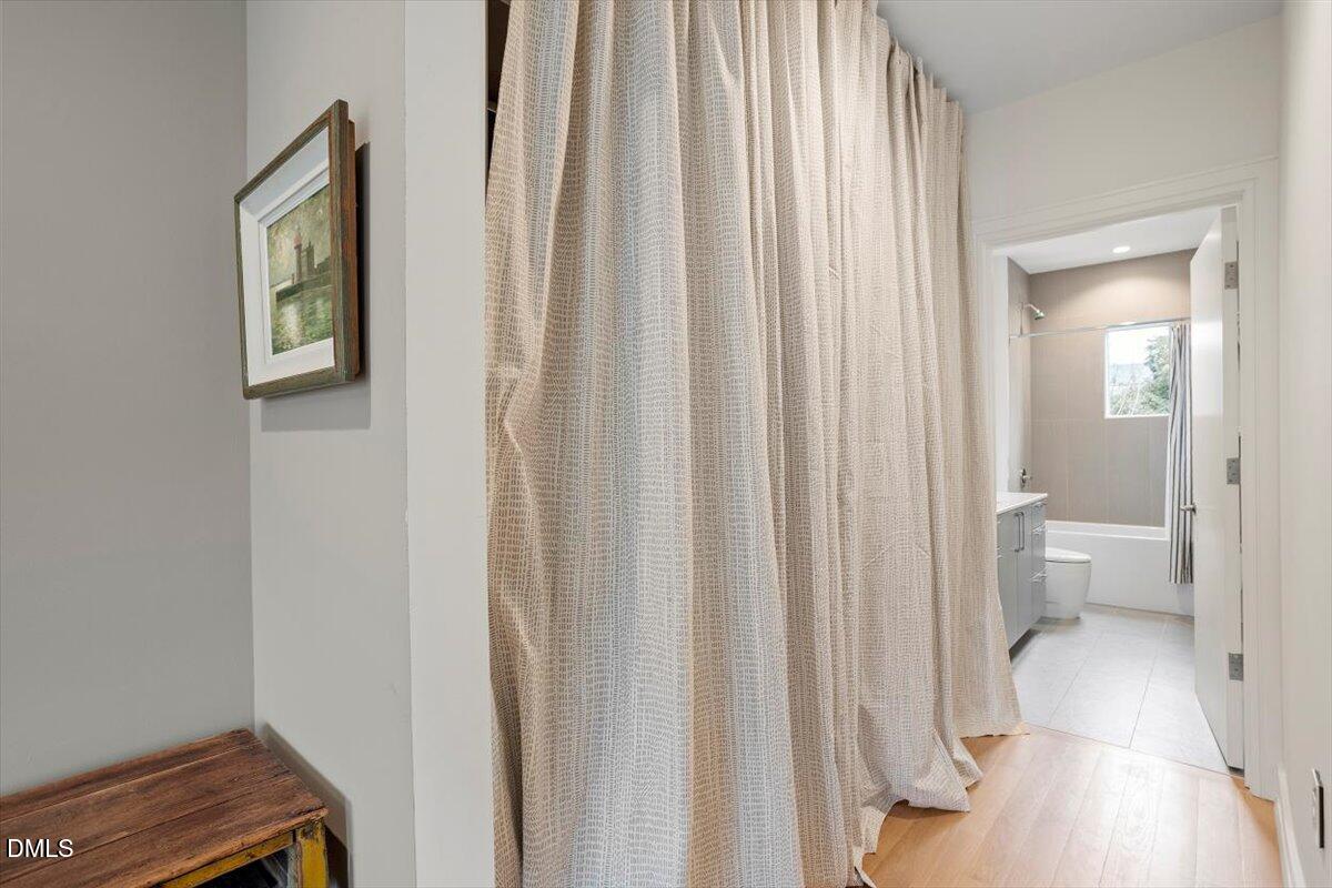 206 Dundas Lane Raleigh, NC 27603 - Photo 18 of 30 a bathroom with a toilet a sink and a mirror