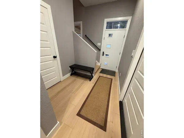 a bathroom with a double vanity sink mirror and toilet