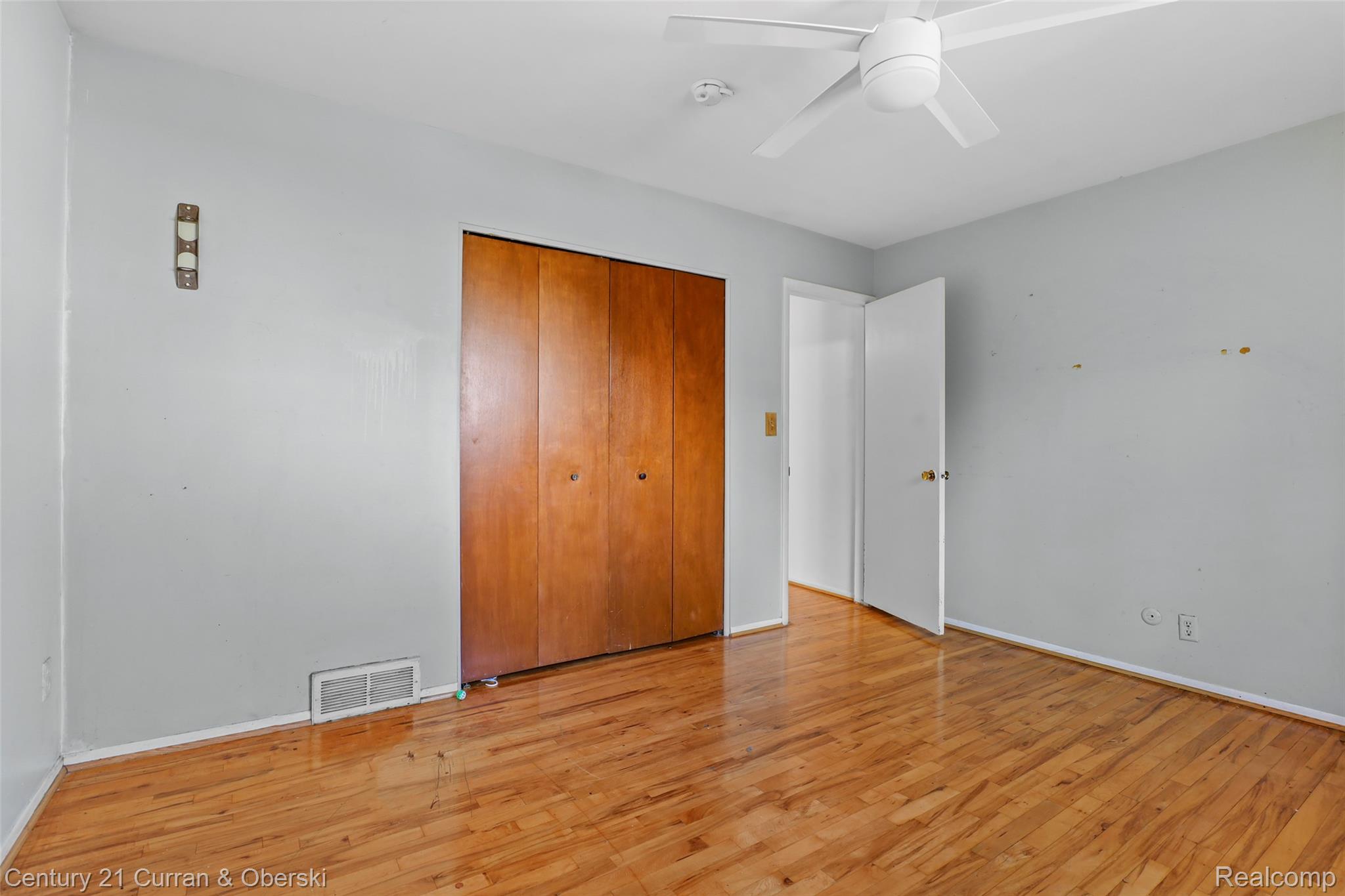 704 Inkster Road Dearborn Heights, MI 48127 - Photo 20 of 32 Wood-finish flooring with a white ceiling fan and light fixture