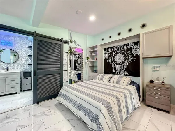 a bedroom with a bed and a walk in closet