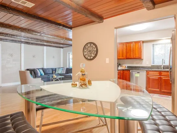 a view of a dining room with furniture and window