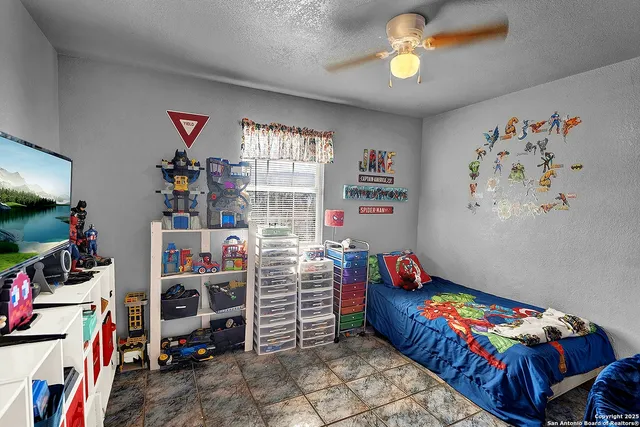 a bedroom with bed and a window