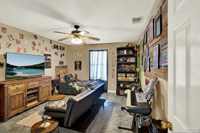a living room with furniture or couch and a flat screen tv