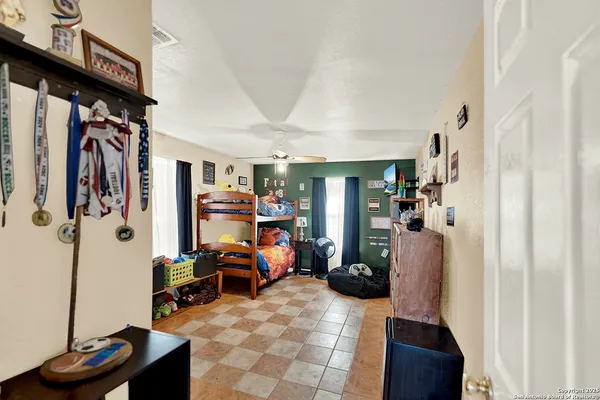 a view of a livingroom with furniture and a flat screen tv