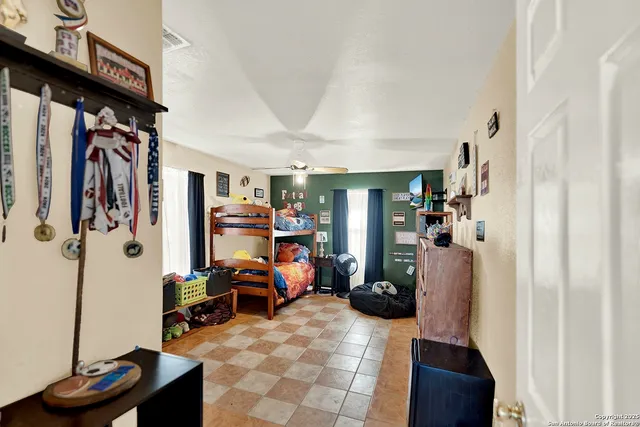 a view of a livingroom with furniture and a flat screen tv