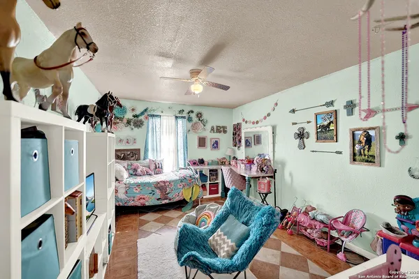 a bedroom with furniture and a chandelier