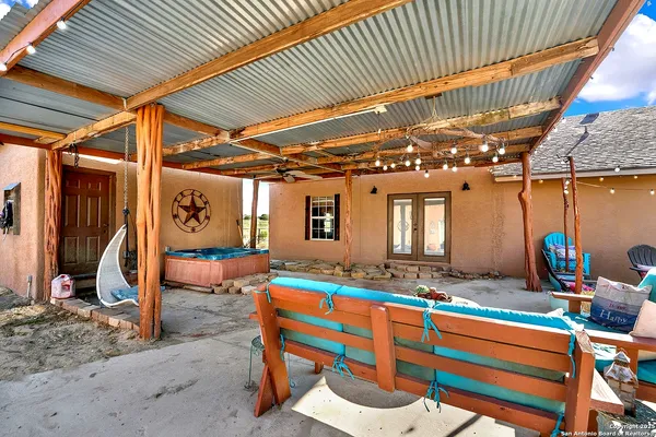 a view of front door with outdoor seating