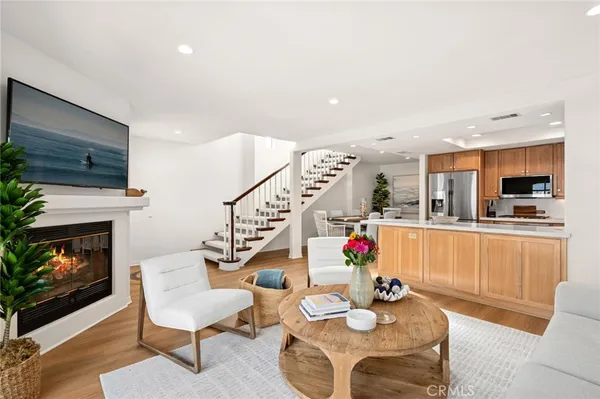 a living room with furniture fireplace and flat screen tv