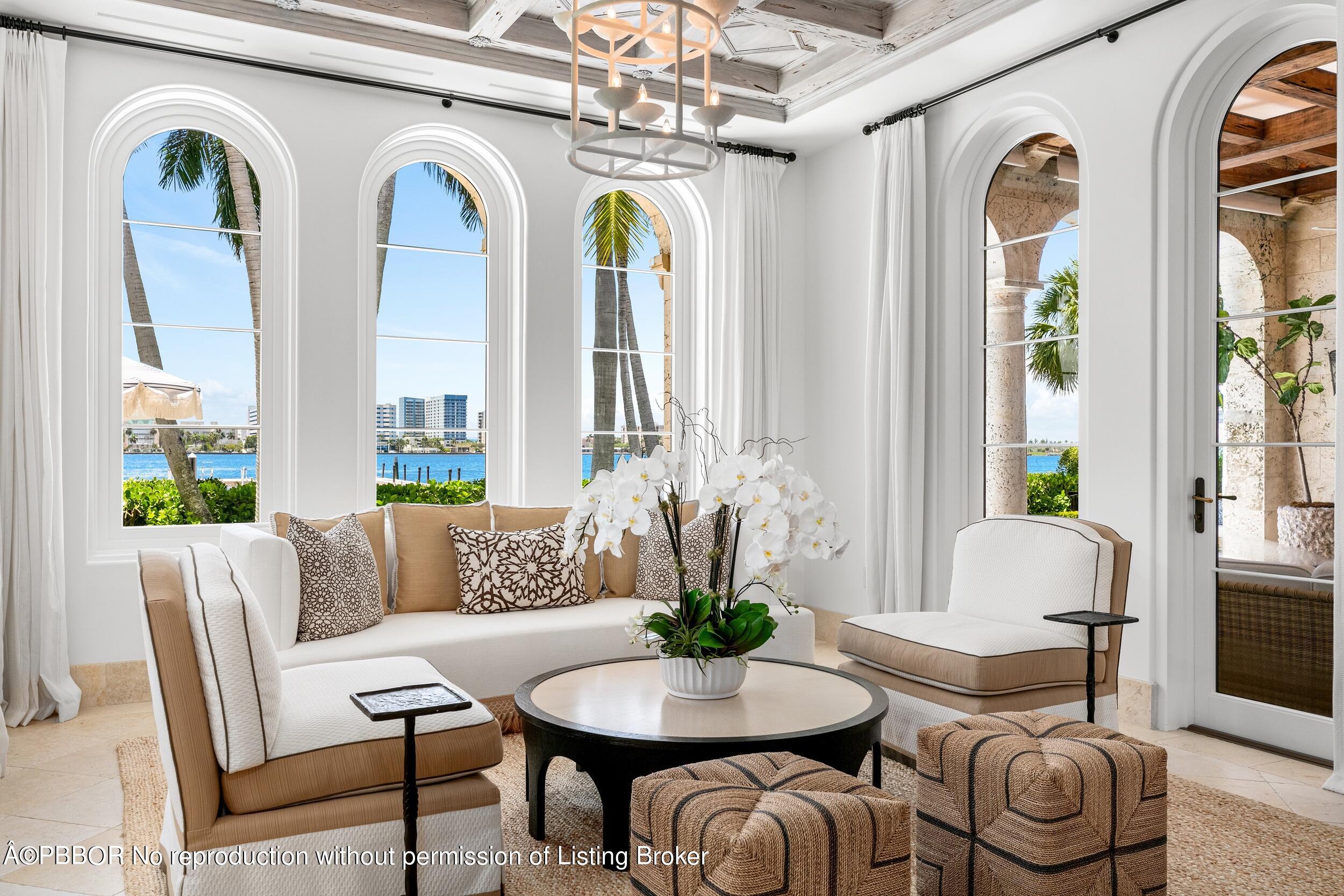 313 Dunbar Road Palm Beach, FL 33480 - Photo 12 of 73 a living room with furniture and a large window