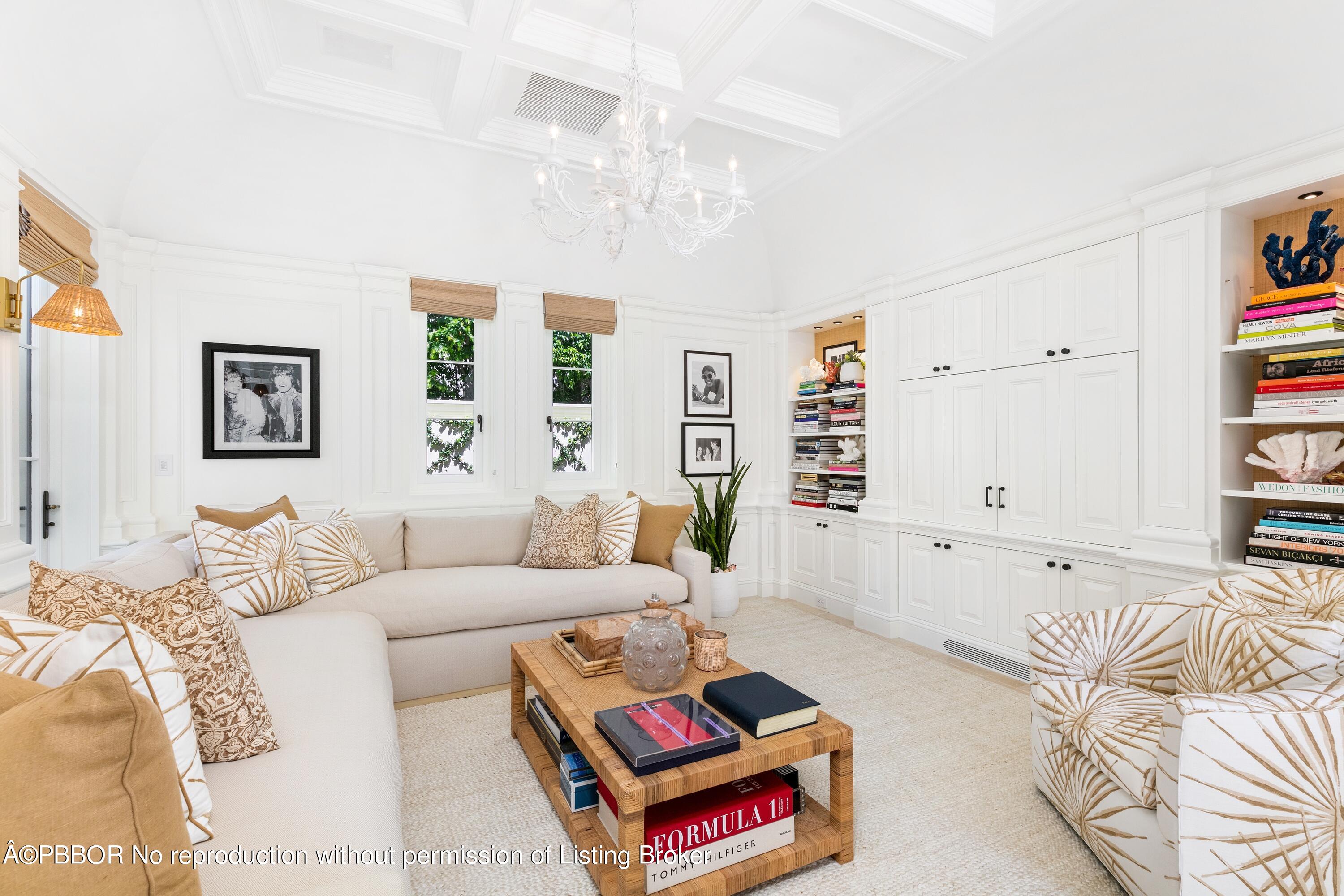 313 Dunbar Road Palm Beach, FL 33480 - Photo 25 of 73 a living room with furniture a rug and a window