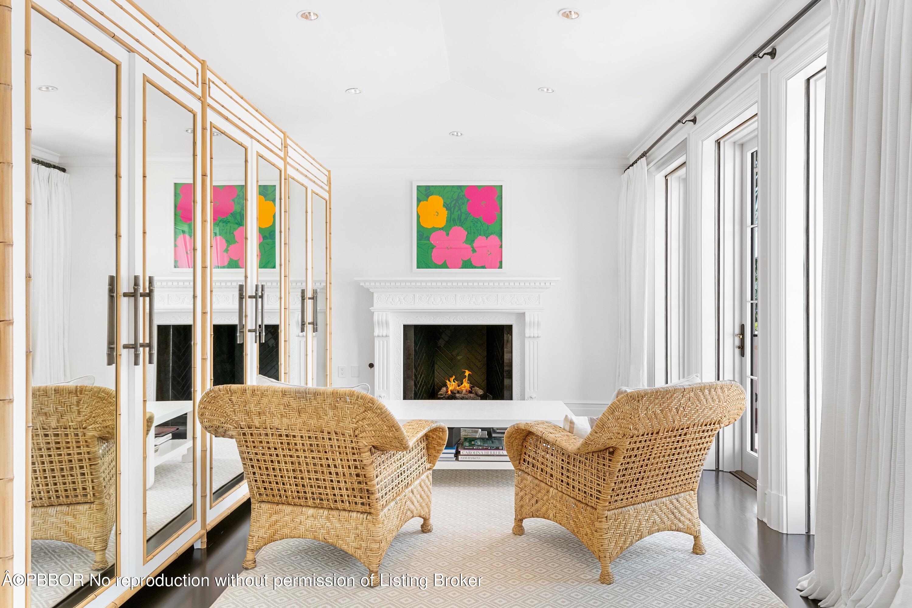 313 Dunbar Road Palm Beach, FL 33480 - Photo 29 of 73 a living room with furniture and a fireplace
