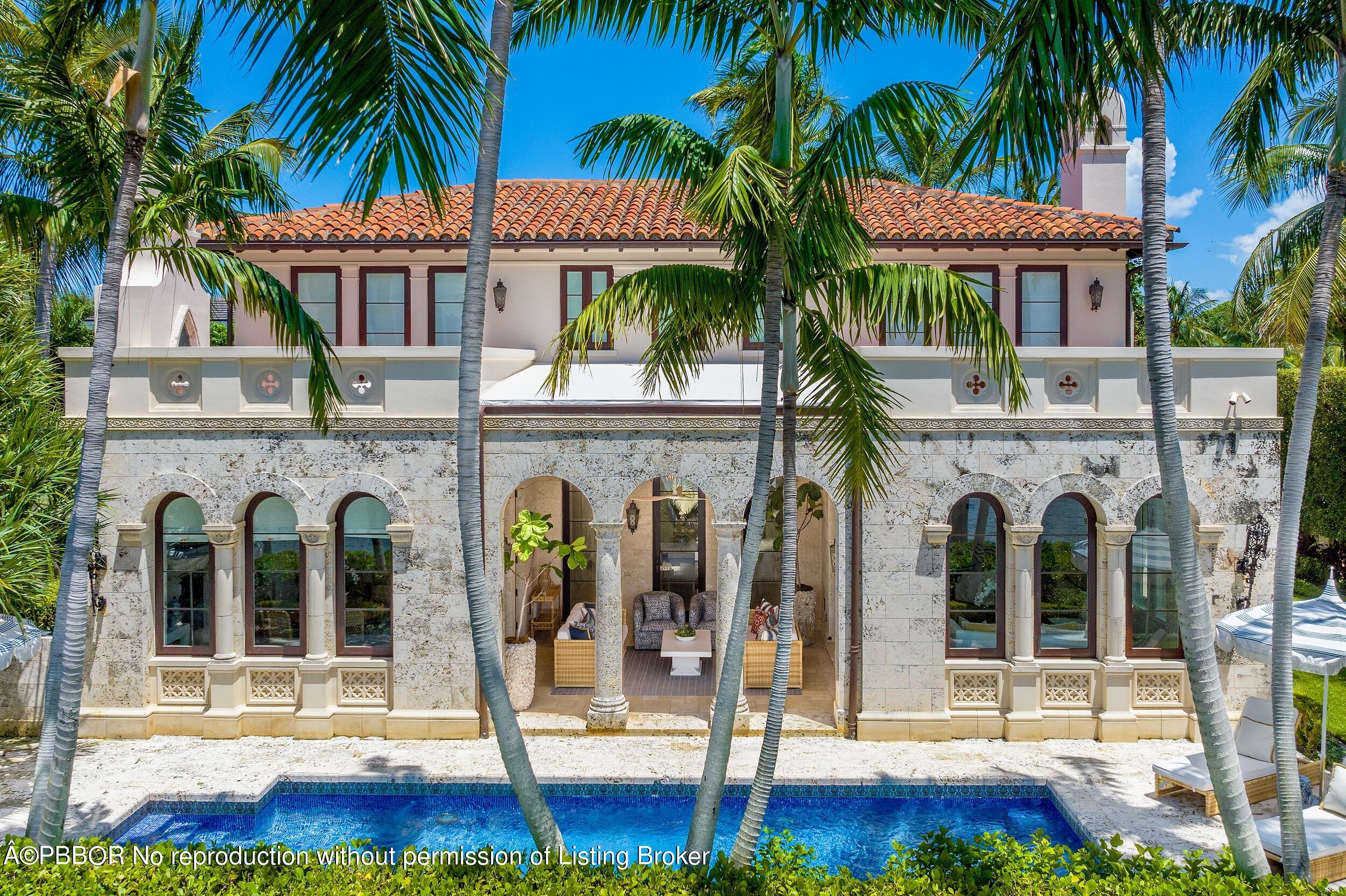 313 Dunbar Road Palm Beach, FL 33480 - Photo 3 of 73 a front view of a house with glass windows and palm tree