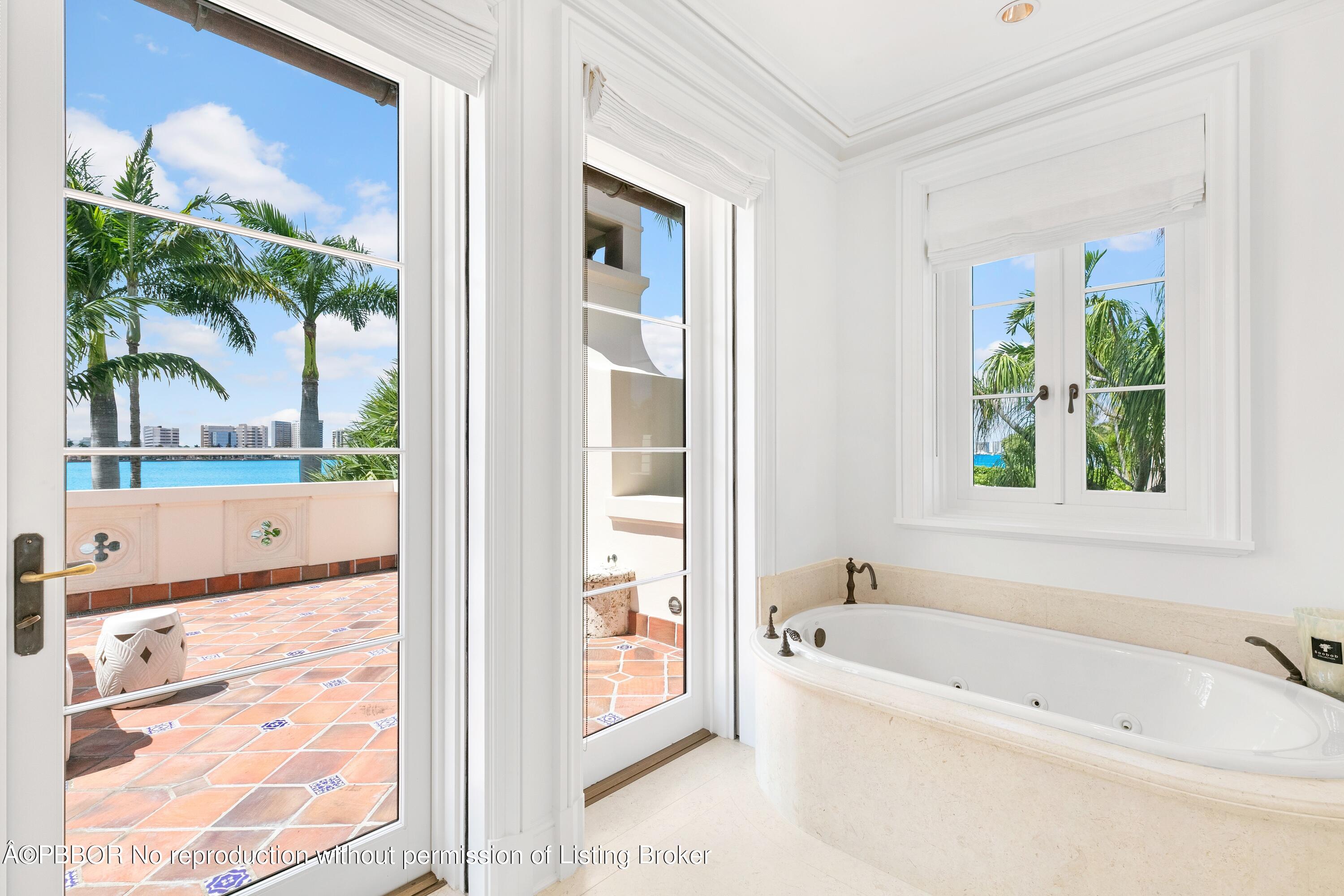 313 Dunbar Road Palm Beach, FL 33480 - Photo 31 of 73 a bathroom with a bathtub and a shower