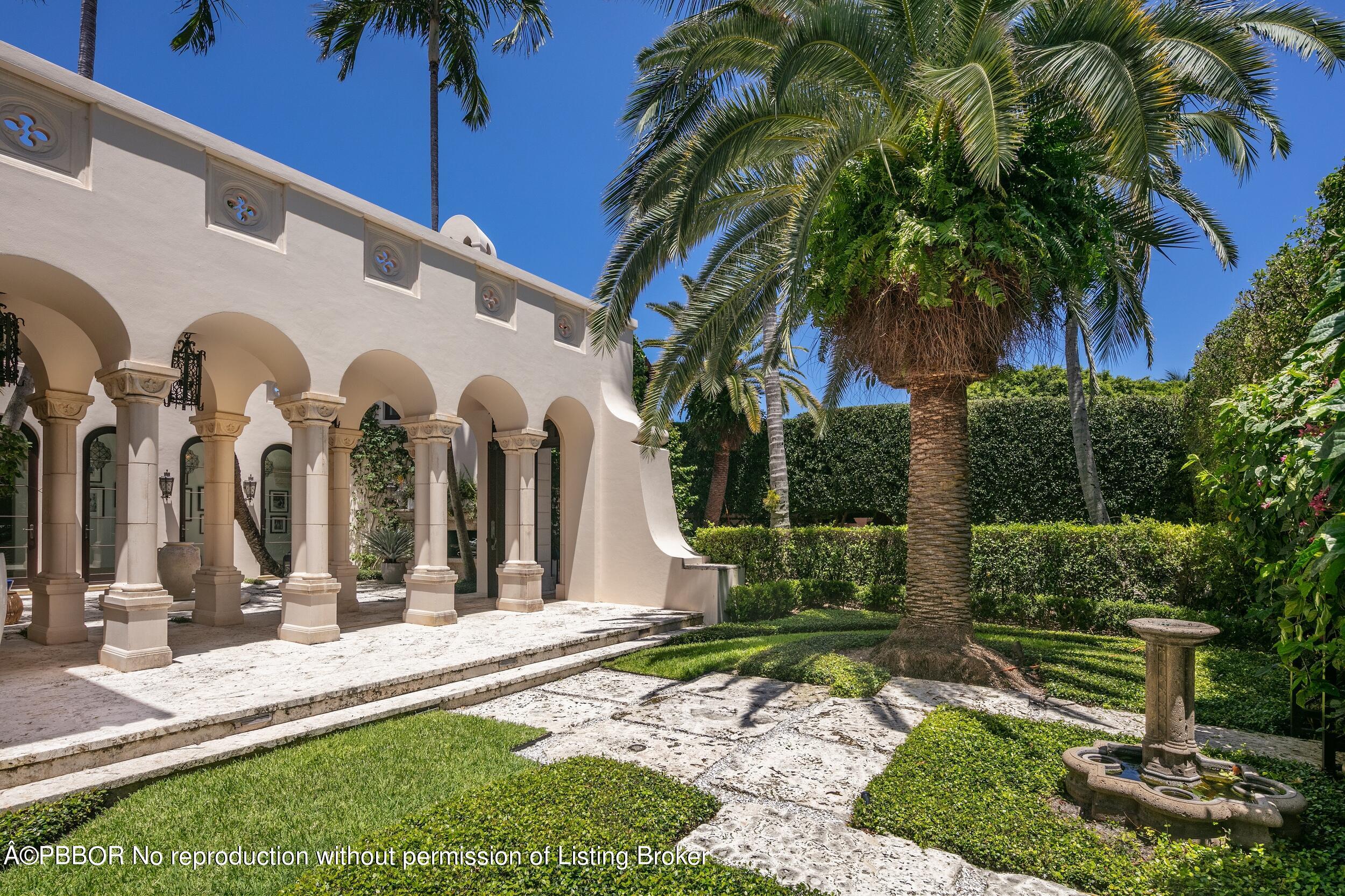 313 Dunbar Road Palm Beach, FL 33480 - Photo 43 of 73 a view of a house with a palm tree