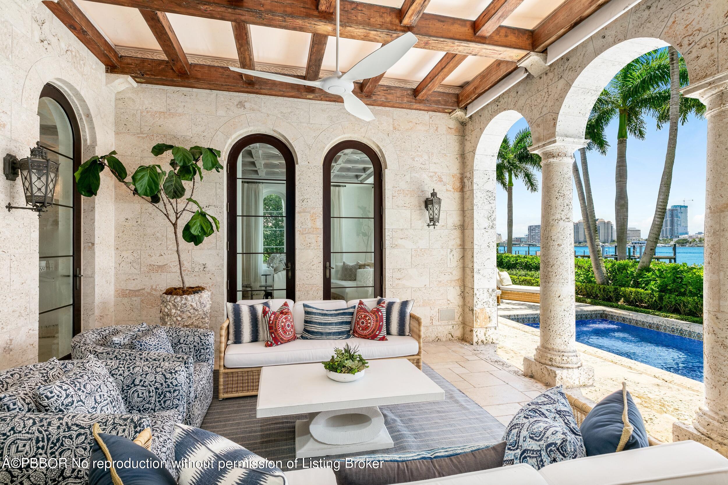313 Dunbar Road Palm Beach, FL 33480 - Photo 48 of 73 a living room with furniture and a potted plant