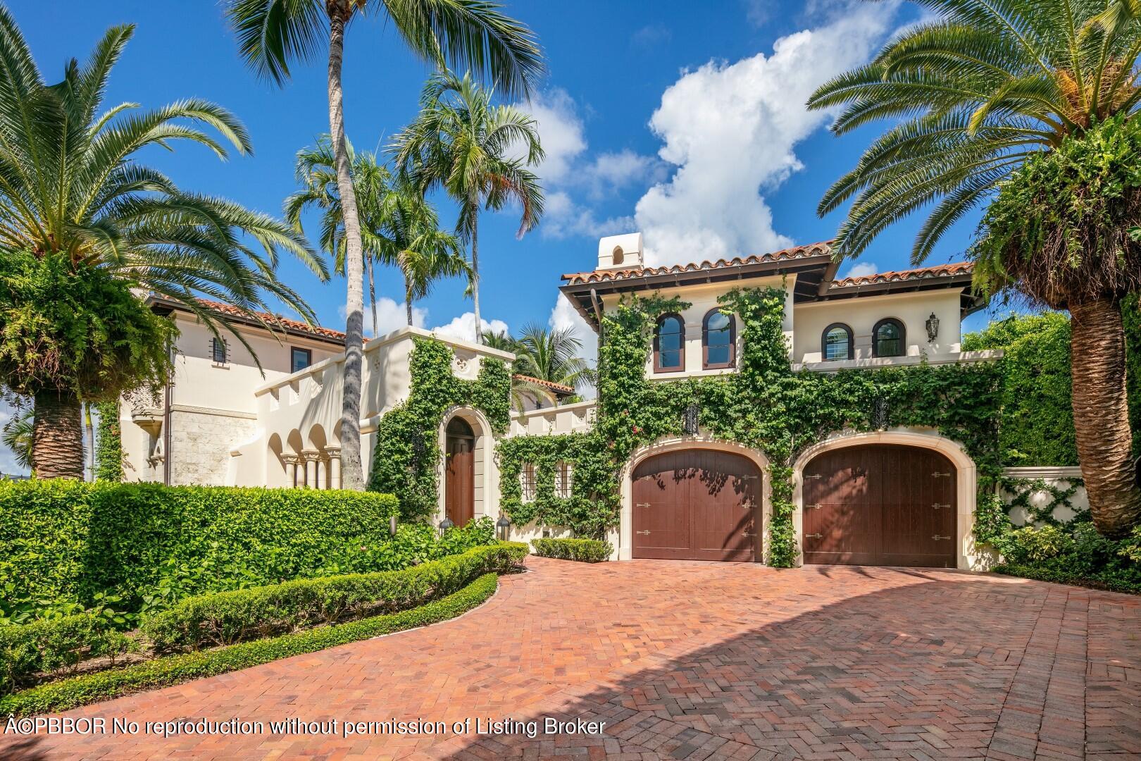 313 Dunbar Road Palm Beach, FL 33480 - Photo 60 of 73 a front view of a house with a yard