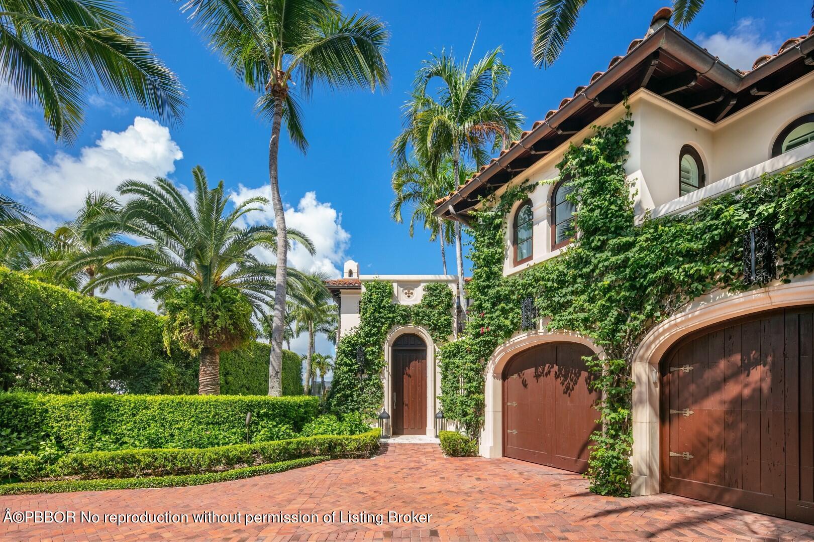 313 Dunbar Road Palm Beach, FL 33480 - Photo 61 of 73 a front view of a house with a yard