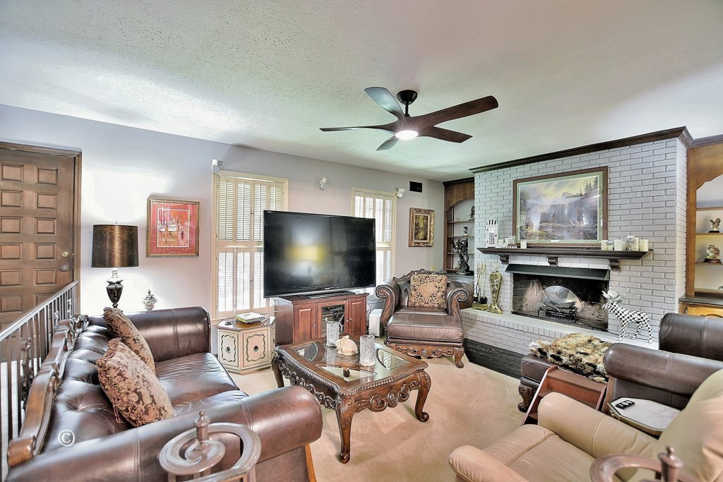 1237 Smith Road Fortson, GA 31808 - Photo 12 of 31 a living room with furniture and a flat screen tv with wooden floor