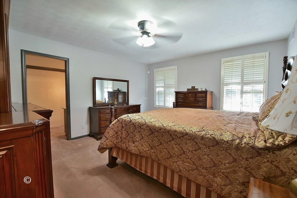 1237 Smith Road Fortson, GA 31808 - Photo 15 of 31 a bedroom with a bed and a flat tv screen on a dresser