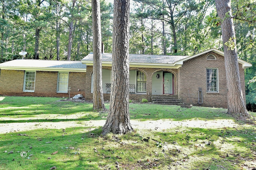 1237 Smith Road Fortson, GA 31808 - Photo 2 of 31 a view of a house with a yard and a large tree
