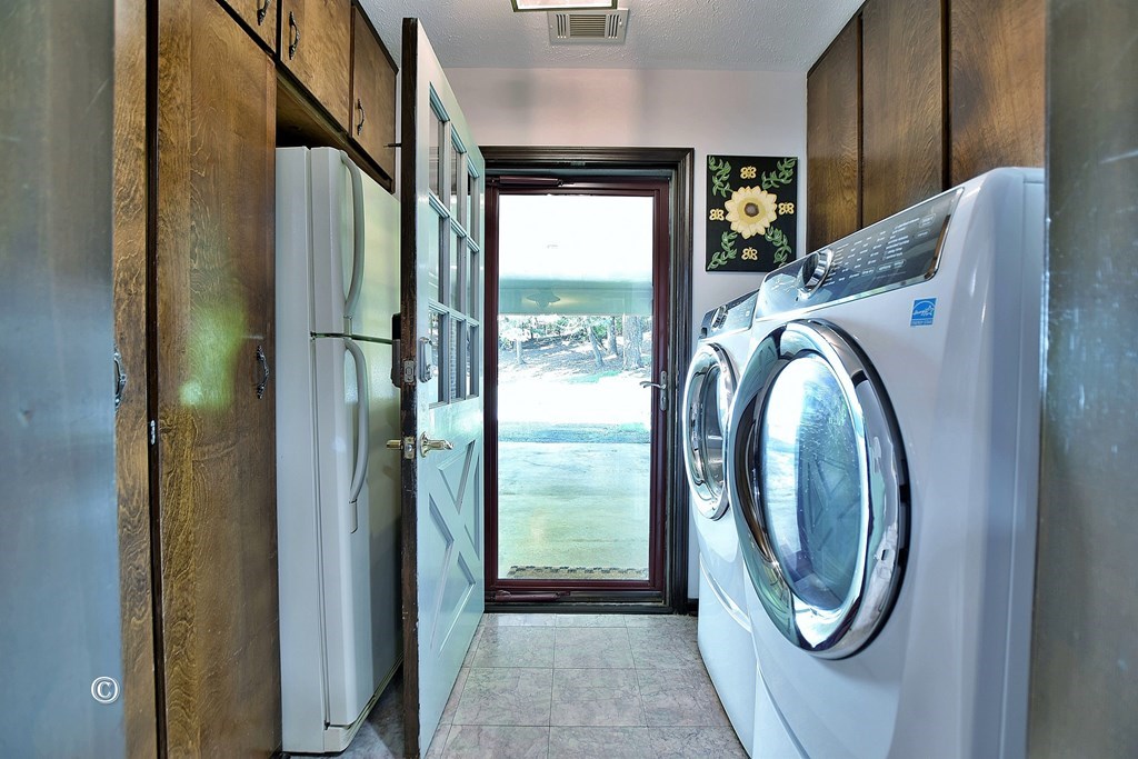 1237 Smith Road Fortson, GA 31808 - Photo 23 of 31 a view of a hallway with washer and dryer