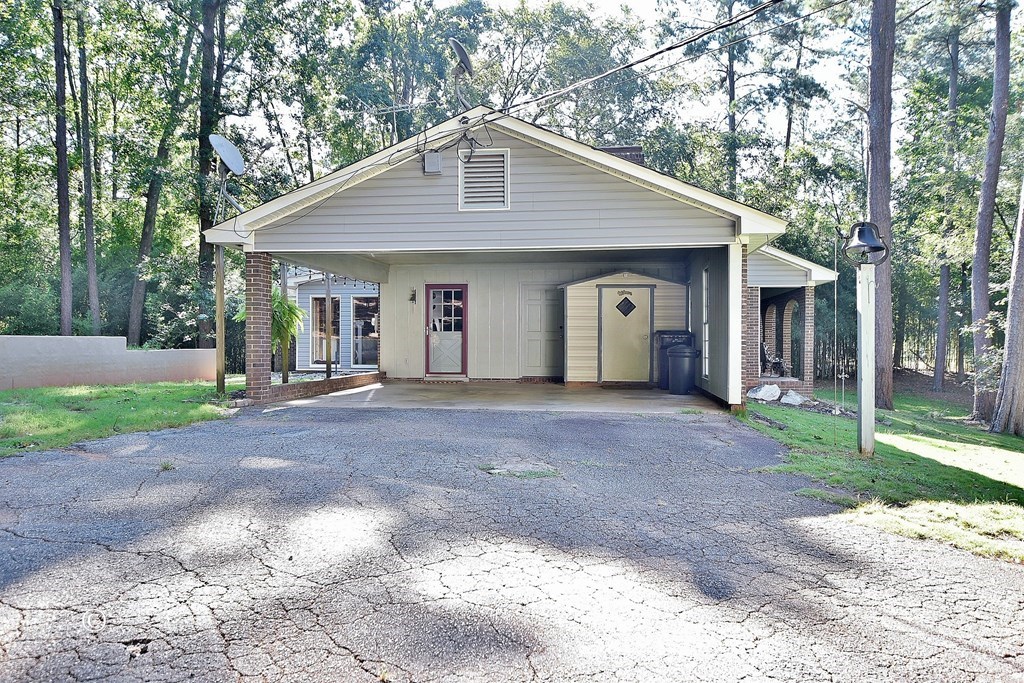 1237 Smith Road Fortson, GA 31808 - Photo 25 of 31 a view of a house with yard and a tree