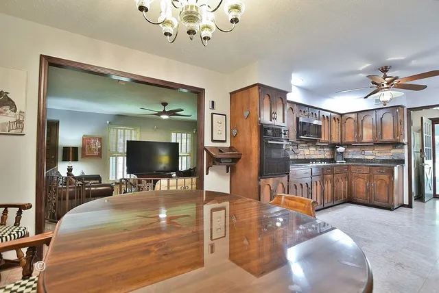 a lobby with furniture and a chandelier