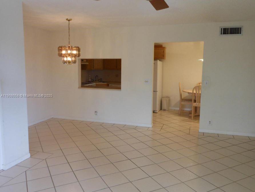 802 Sky Pine Way, Unit B2 Greenacres, FL 33415 - Photo 2 of 9 a view of a livingroom with an empty space