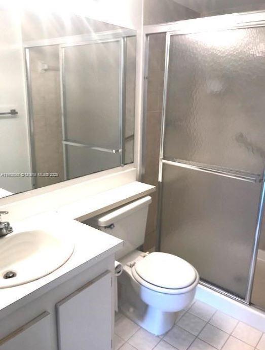 802 Sky Pine Way, Unit B2 Greenacres, FL 33415 - Photo 6 of 9 a bathroom with a toilet a sink and shower
