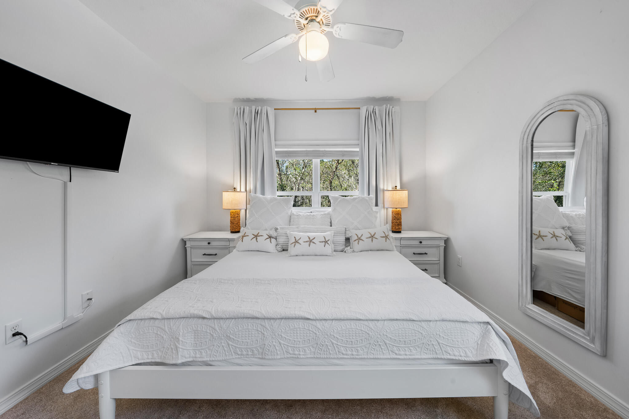 34 Heron's Watch Way, Unit 7205 Santa Rosa Beach, FL 32459 - Photo 21 of 49 a bedroom with a bed and a flat tv screen on the dresser